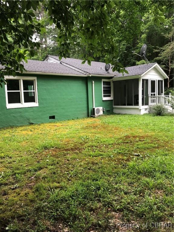 271 Bendall Ln, Mathews, VA 23109 - back of property with a sunroom, roof with shingles, and a yard