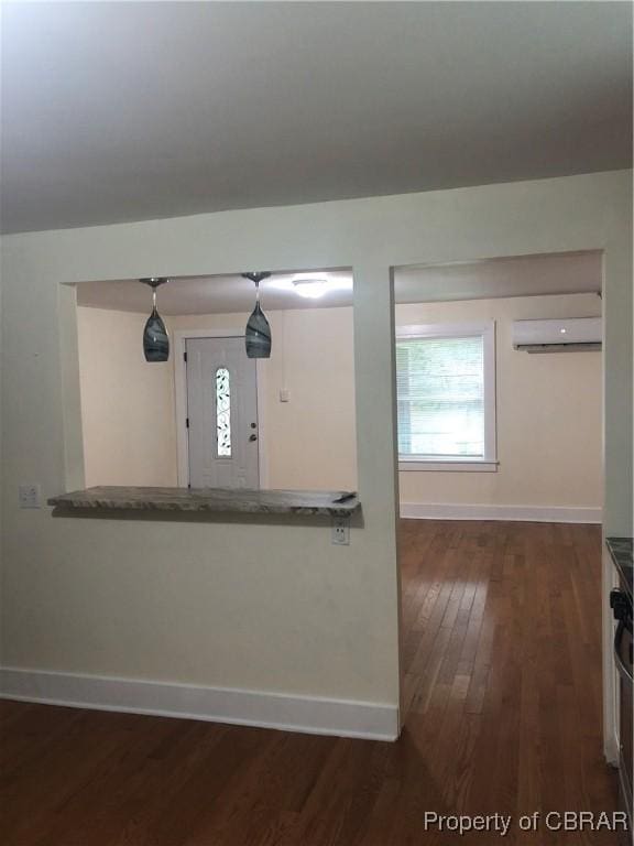 271 Bendall Ln, Mathews, VA 23109 - interior space with dark wood-type flooring and a wall unit AC