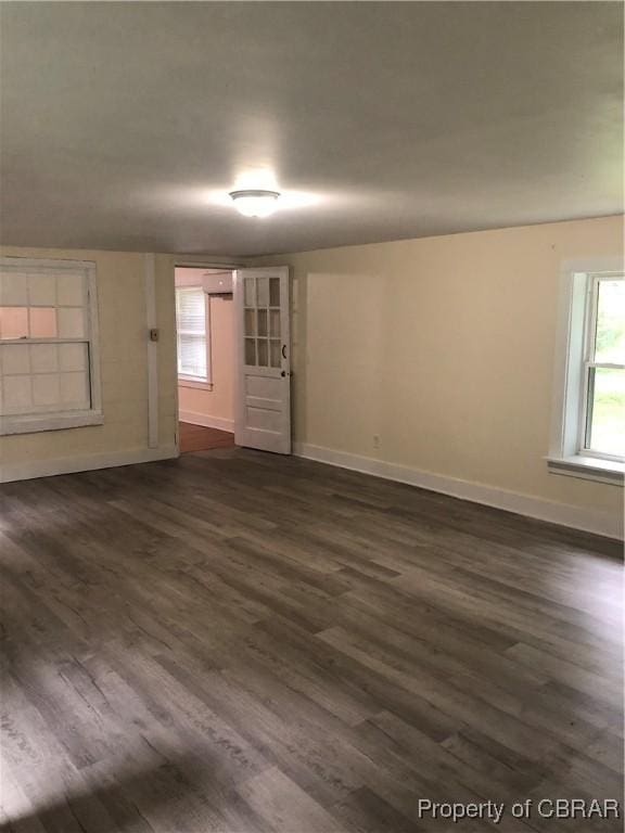 271 Bendall Ln, Mathews, VA 23109 - spare room with dark wood finished floors and a wall unit AC