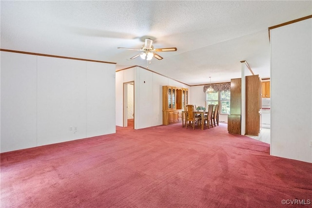 4867 Tabscott Rd, Kents Store, VA 23084 - carpeted living room with ceiling fan, vaulted ceiling, ornamental molding, and a textured ceiling