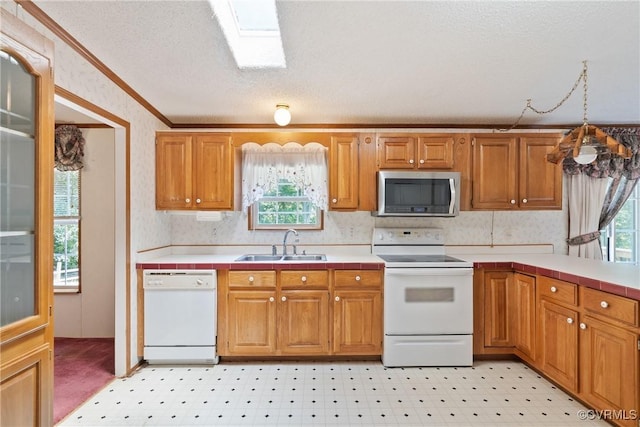 4867 Tabscott Rd, Kents Store, VA 23084 - kitchen with white appliances, crown molding, wallpapered walls, a textured ceiling, and brown cabinetry
