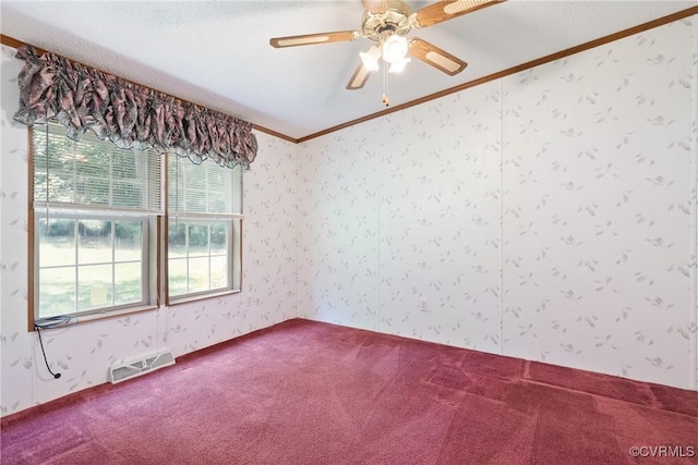 4867 Tabscott Rd, Kents Store, VA 23084 - spare room with crown molding, dark colored carpet, wallpapered walls, and ceiling fan
