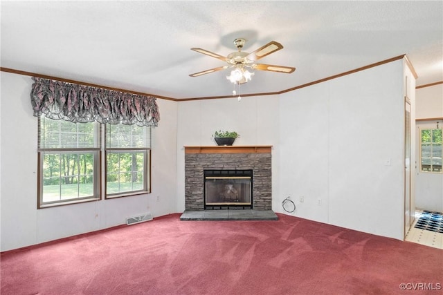 4867 Tabscott Rd, Kents Store, VA 23084 - unfurnished living room with ceiling fan, healthy amount of natural light, carpet floors, crown molding, and a stone fireplace