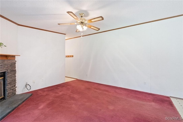 4867 Tabscott Rd, Kents Store, VA 23084 - unfurnished living room featuring a stone fireplace, carpet flooring, ceiling fan, and crown molding