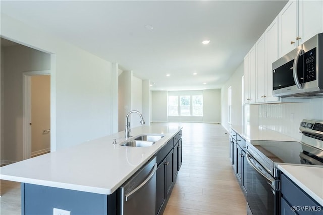 14631 Hancock Towns Dr Unit N6, Chesterfield, VA 23832 - kitchen with appliances with stainless steel finishes, light wood-type flooring, light countertops, open floor plan, and white cabinets