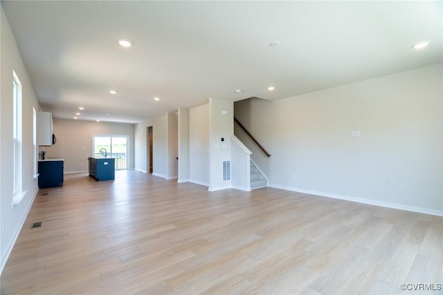 14631 Hancock Towns Dr Unit N6, Chesterfield, VA 23832 - unfurnished living room with light wood finished floors, stairs, and recessed lighting