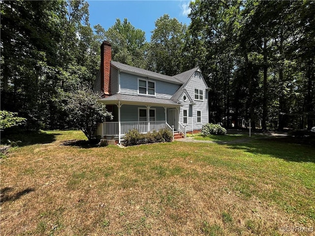 16200 Hunters Ridge Ln, Moseley, VA 23120 - view of front of home with a porch, a chimney, a front yard, and roof with shingles