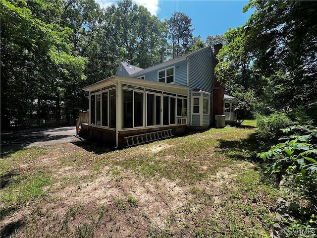 16200 Hunters Ridge Ln, Moseley, VA 23120 - back of property featuring a sunroom and a chimney