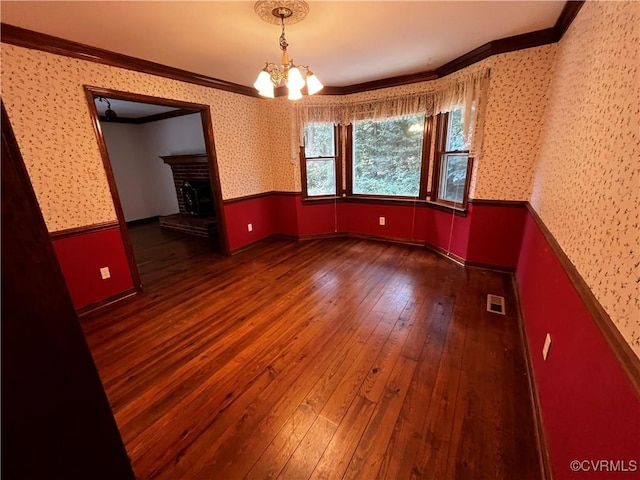 16200 Hunters Ridge Ln, Moseley, VA 23120 - spare room with crown molding, hardwood / wood-style floors, a chandelier, a fireplace, and wallpapered walls