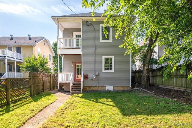 2502 4th Ave, Richmond, VA 23222 - back of property with a balcony and a fenced backyard