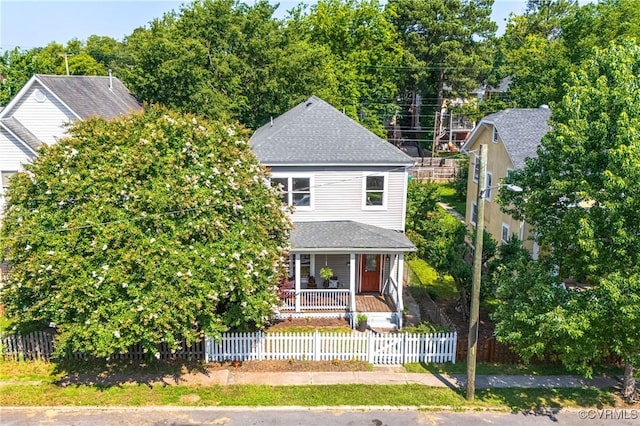 2502 4th Ave, Richmond, VA 23222 - view of front of home featuring covered porch, a fenced front yard, and a shingled roof