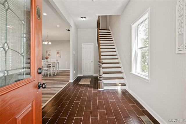 2502 4th Ave, Richmond, VA 23222 - entrance foyer featuring stairway, dark wood-type flooring, and a chandelier