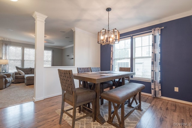 9545 Thornecrest Dr, Mechanicsville, VA 23116 - dining area with ornamental molding, a chandelier, and wood finished floors