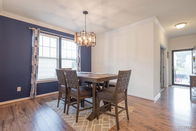 9545 Thornecrest Dr, Mechanicsville, VA 23116 - dining area with a chandelier, wood finished floors, and crown molding