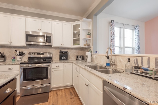 9545 Thornecrest Dr, Mechanicsville, VA 23116 - kitchen featuring stainless steel appliances, white cabinetry, backsplash, light wood-style flooring, and ornamental molding