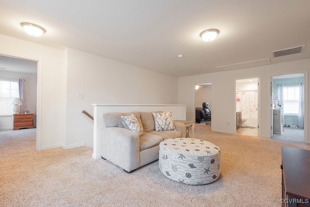 9545 Thornecrest Dr, Mechanicsville, VA 23116 - carpeted living area with attic access and baseboards