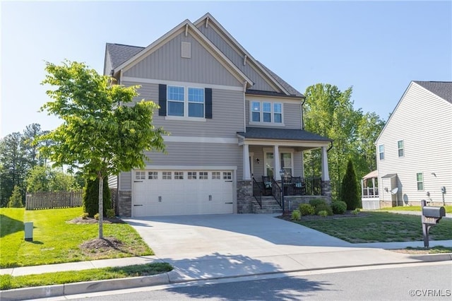9545 Thornecrest Dr, Mechanicsville, VA 23116 - craftsman inspired home featuring board and batten siding, a porch, a garage, driveway, and stone siding
