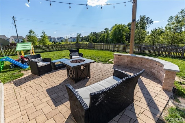 9545 Thornecrest Dr, Mechanicsville, VA 23116 - fenced backyard with an outdoor fire pit, a patio area, and a playground