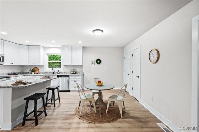 487 Deep Landing Rd, Tappahannock, VA 22560 - dining area featuring light wood finished floors and recessed lighting