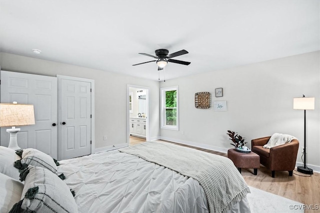 487 Deep Landing Rd, Tappahannock, VA 22560 - bedroom with light wood-style floors, ceiling fan, a closet, and ensuite bathroom