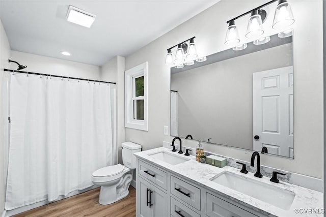 487 Deep Landing Rd, Tappahannock, VA 22560 - full bathroom with wood finished floors, double vanity, recessed lighting, and a shower with curtain