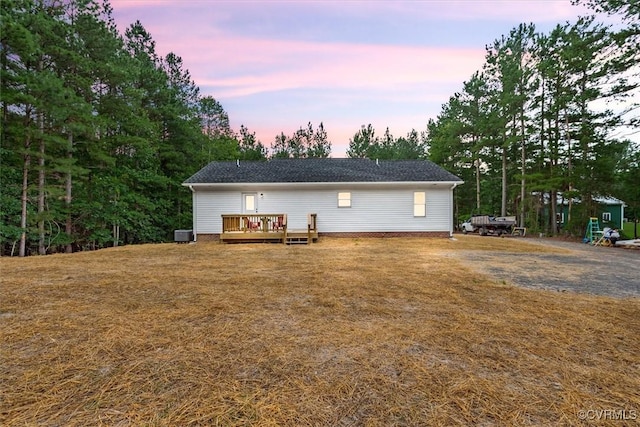 487 Deep Landing Rd, Tappahannock, VA 22560 - back of property at dusk featuring a deck