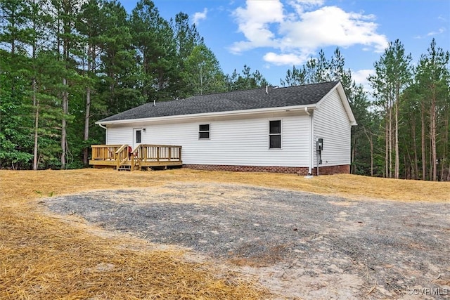 487 Deep Landing Rd, Tappahannock, VA 22560 - view of home's exterior with a deck and roof with shingles