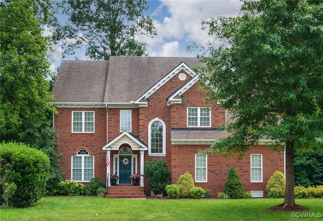 4313 Nevil Bend Turn, Moseley, VA 23120 - view of front of property featuring a front yard, brick siding, and roof with shingles