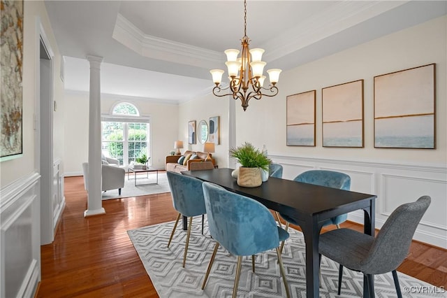 4313 Nevil Bend Turn, Moseley, VA 23120 - dining space with wood finished floors, crown molding, ornate columns, a chandelier, and a raised ceiling