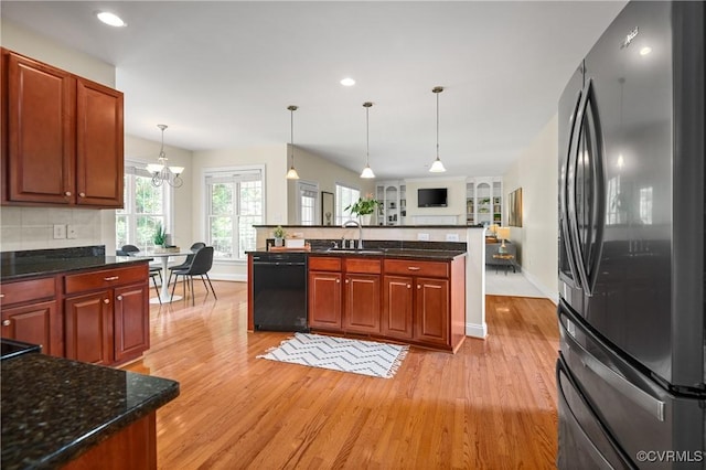 4313 Nevil Bend Turn, Moseley, VA 23120 - kitchen with freestanding refrigerator, dishwasher, light wood-style floors, open floor plan, and recessed lighting