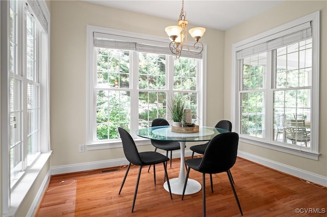 4313 Nevil Bend Turn, Moseley, VA 23120 - dining space with a chandelier and light wood-style flooring