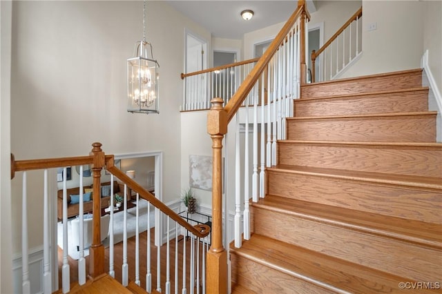 4313 Nevil Bend Turn, Moseley, VA 23120 - stairway with a chandelier and wood finished floors