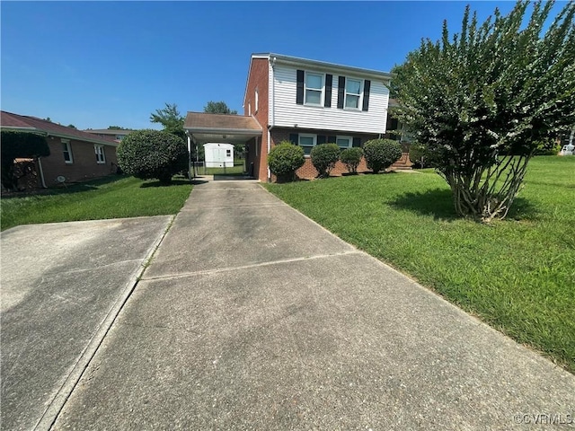 38 Spring Ct, Petersburg, VA 23803 - view of front facade featuring driveway, a front yard, and an attached carport