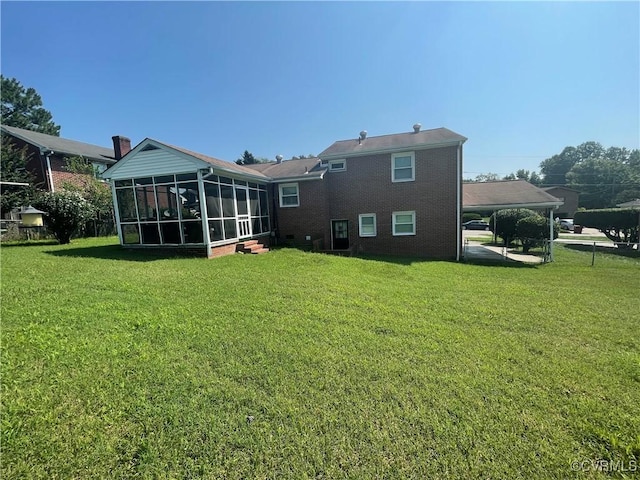 38 Spring Ct, Petersburg, VA 23803 - back of house with a sunroom, a yard, and brick siding