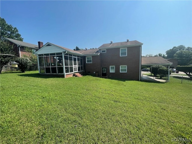 38 Spring Ct, Petersburg, VA 23803 - rear view of house with a sunroom, a yard, a carport, and brick siding