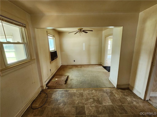 25521 Ferndale Rd, Petersburg, VA 23803 - empty room featuring dark colored carpet, a ceiling fan, and dark stone finish flooring