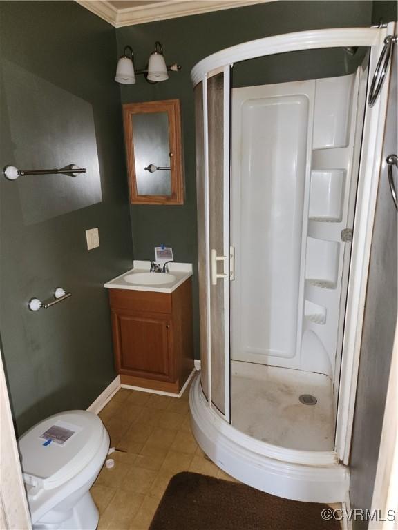 25521 Ferndale Rd, Petersburg, VA 23803 - full bath featuring a shower stall, vanity, tile patterned floors, and crown molding