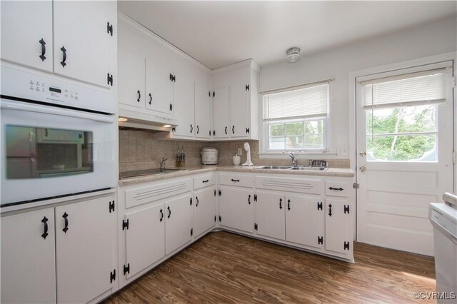 916 Forestview Dr, Colonial Heights, VA 23834 - kitchen featuring white oven, under cabinet range hood, black electric stovetop, light countertops, and white cabinetry