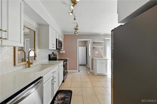 108 Bristol Ave, Norfolk, VA 23502 - kitchen featuring stainless steel appliances, white cabinetry, tasteful backsplash, light countertops, and light tile patterned floors