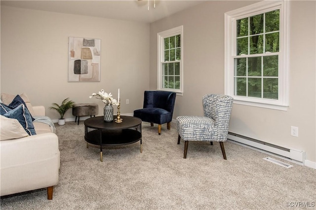 7856 Epic Rd, Midlothian, VA 23235 - living room featuring a baseboard heating unit, carpet floors, and a ceiling fan