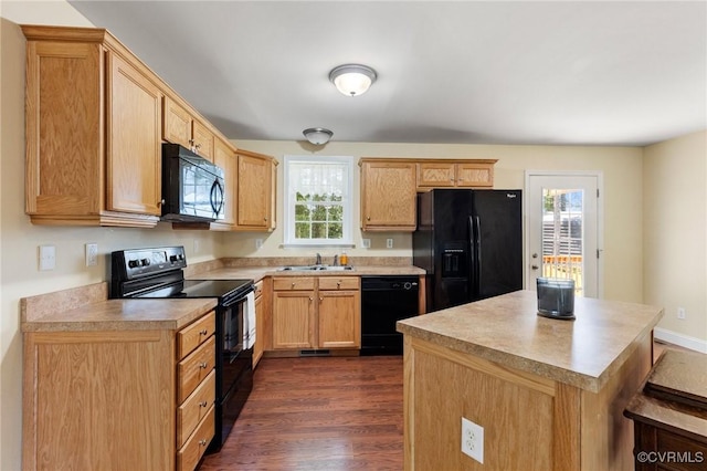 3899 Howell Rd, Powhatan, VA 23139 - kitchen featuring black appliances, dark wood-type flooring, light countertops, and a kitchen island