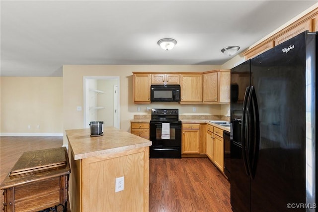 3899 Howell Rd, Powhatan, VA 23139 - kitchen with black appliances, light brown cabinets, and light countertops