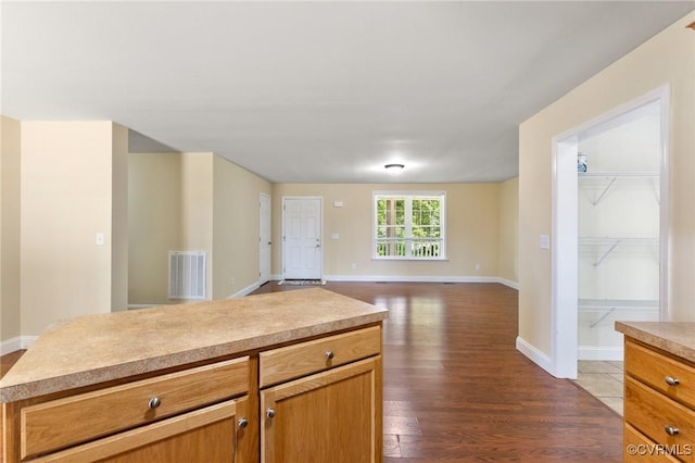 3899 Howell Rd, Powhatan, VA 23139 - kitchen with dark wood-style flooring, light countertops, and open floor plan
