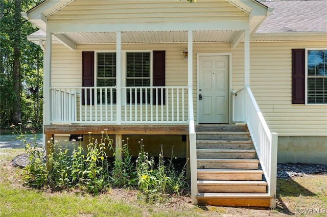 3899 Howell Rd, Powhatan, VA 23139 - property entrance with a porch and roof with shingles