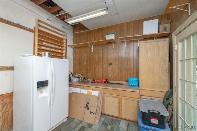 3949 Llewellyn Ln, Chesterfield, VA 23832 - kitchen with white fridge with ice dispenser, open shelves, wood walls, light countertops, and light brown cabinetry