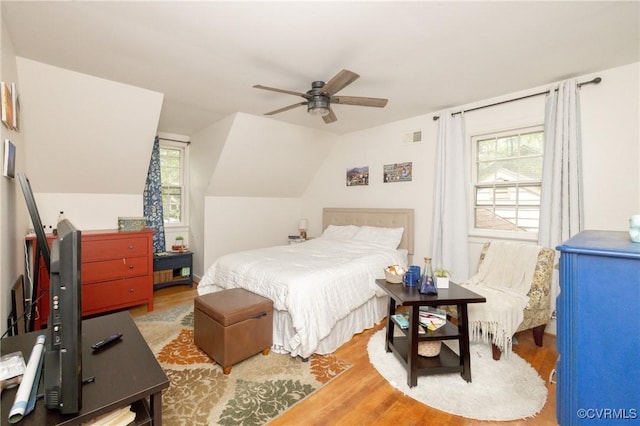 3949 Llewellyn Ln, Chesterfield, VA 23832 - bedroom with wood finished floors, multiple windows, vaulted ceiling, and a ceiling fan