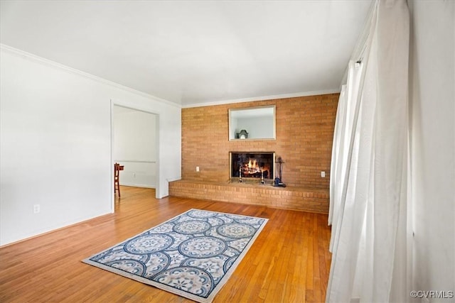 43 Franktown Rd, Hampton, VA 23663 - unfurnished living room with a brick fireplace, wood finished floors, and crown molding
