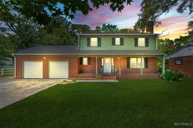 43 Franktown Rd, Hampton, VA 23663 - traditional home with a chimney, an attached garage, concrete driveway, a porch, and brick siding