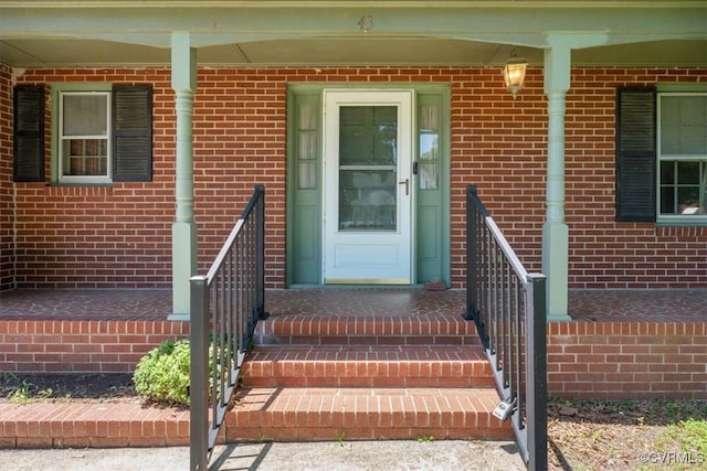 43 Franktown Rd, Hampton, VA 23663 - doorway to property with brick siding and covered porch