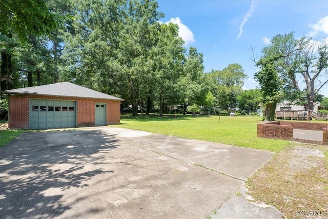 43 Franktown Rd, Hampton, VA 23663 - view of green lawn with driveway, an outbuilding, and a garage